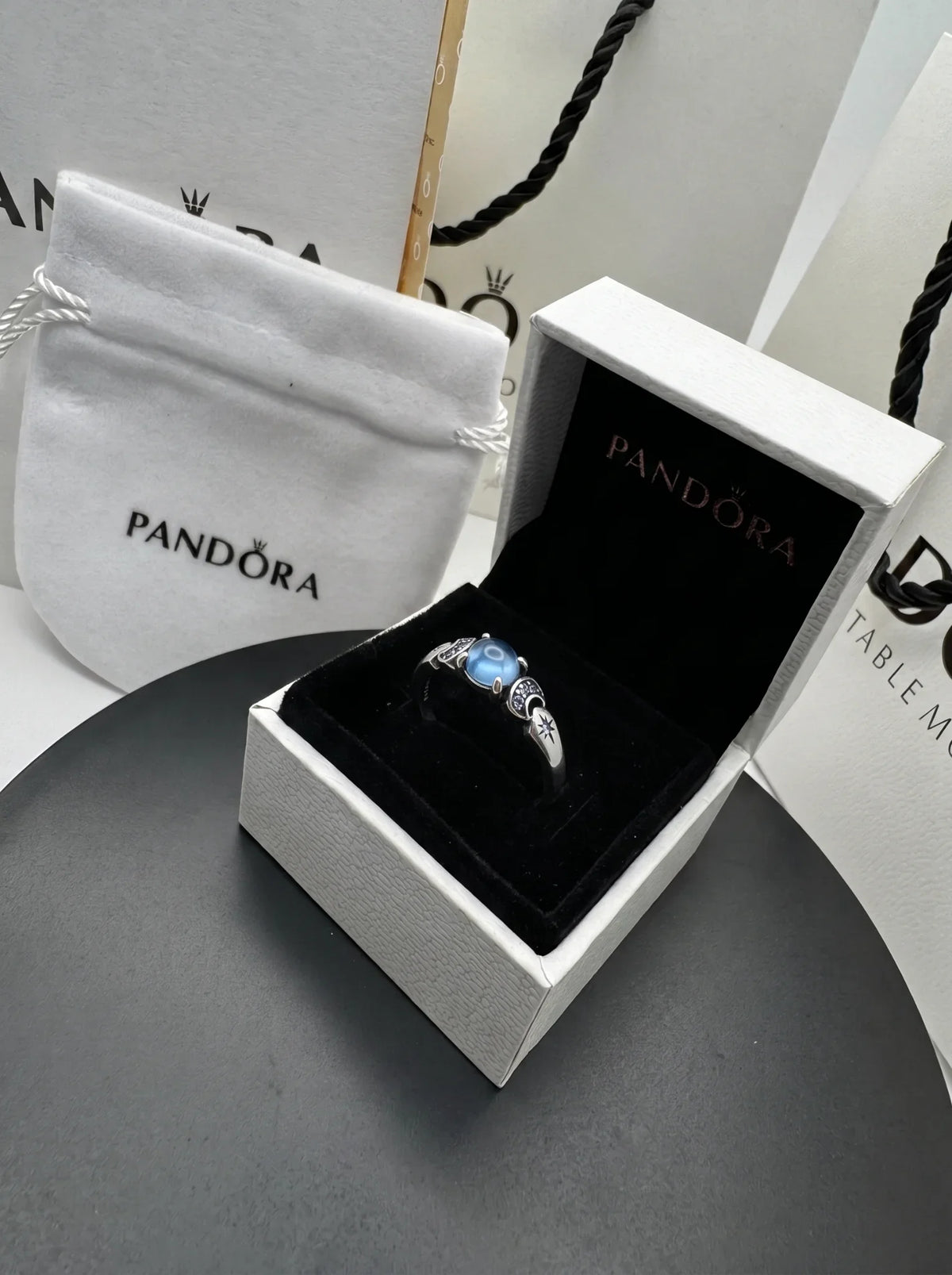 Pandora Celestially Engraved Blue Gemstone Ring - Placing_ring_in_jewelry_box_2K_20261016195554.webp
