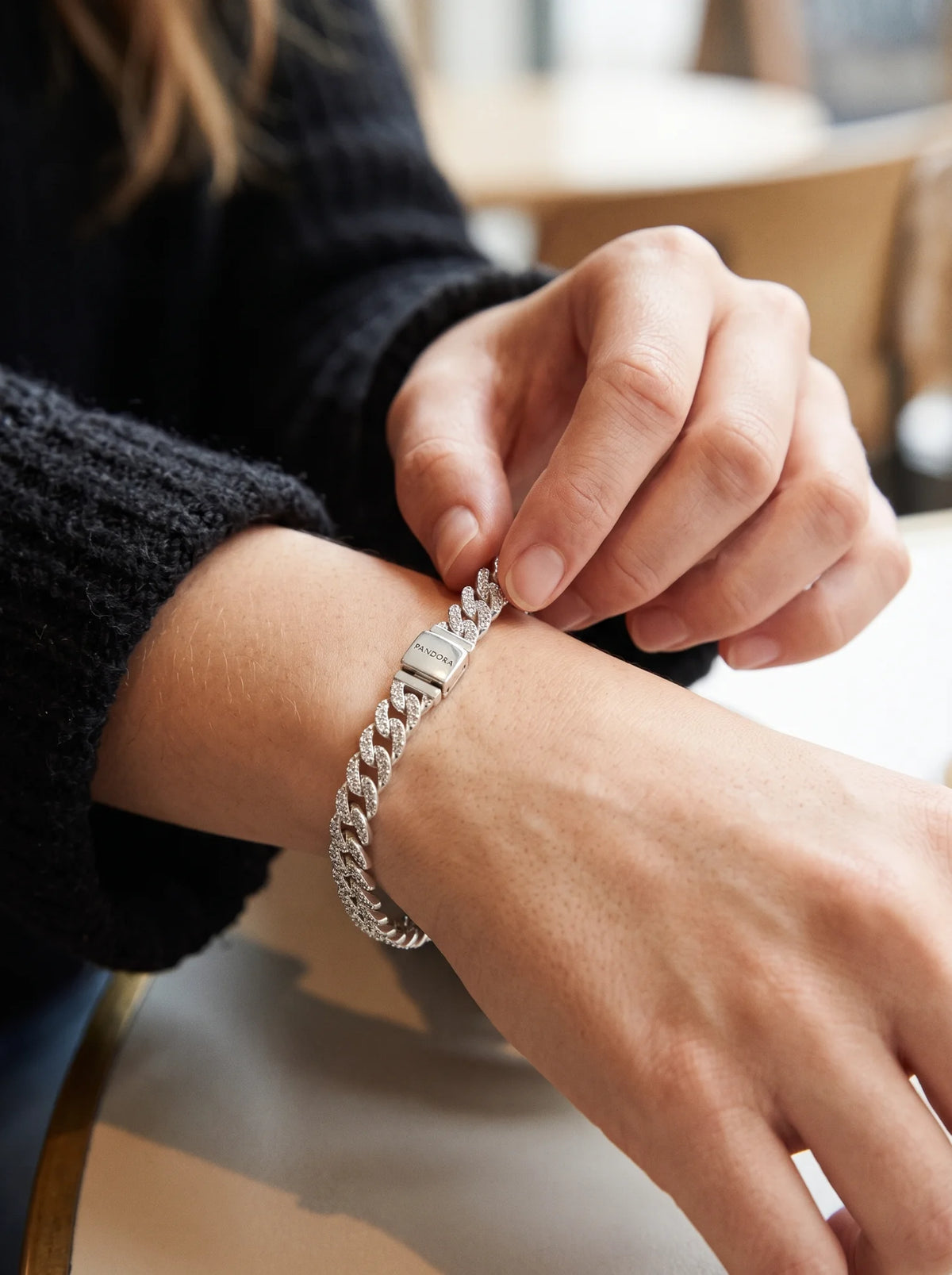 Pavé Cuban Link - Woman_adjusting_bracelet_2K_20261023190922.webp