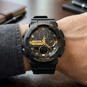 Casio G-Shock GA-100 – Black & Gold Sport Watch - Naggat Silver