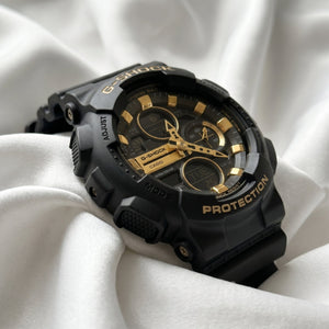Casio G-Shock GA-100 – Black & Gold Sport Watch - Naggat Silver